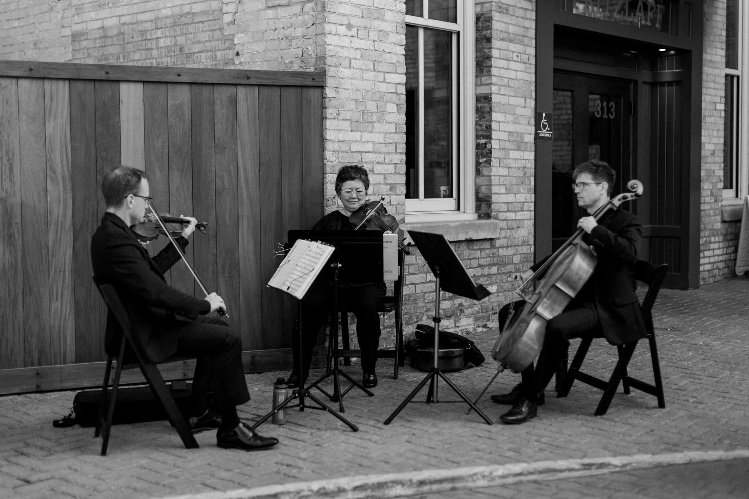 string trio, Gabriel's Horns, plays for a couple's outdoor ceremony