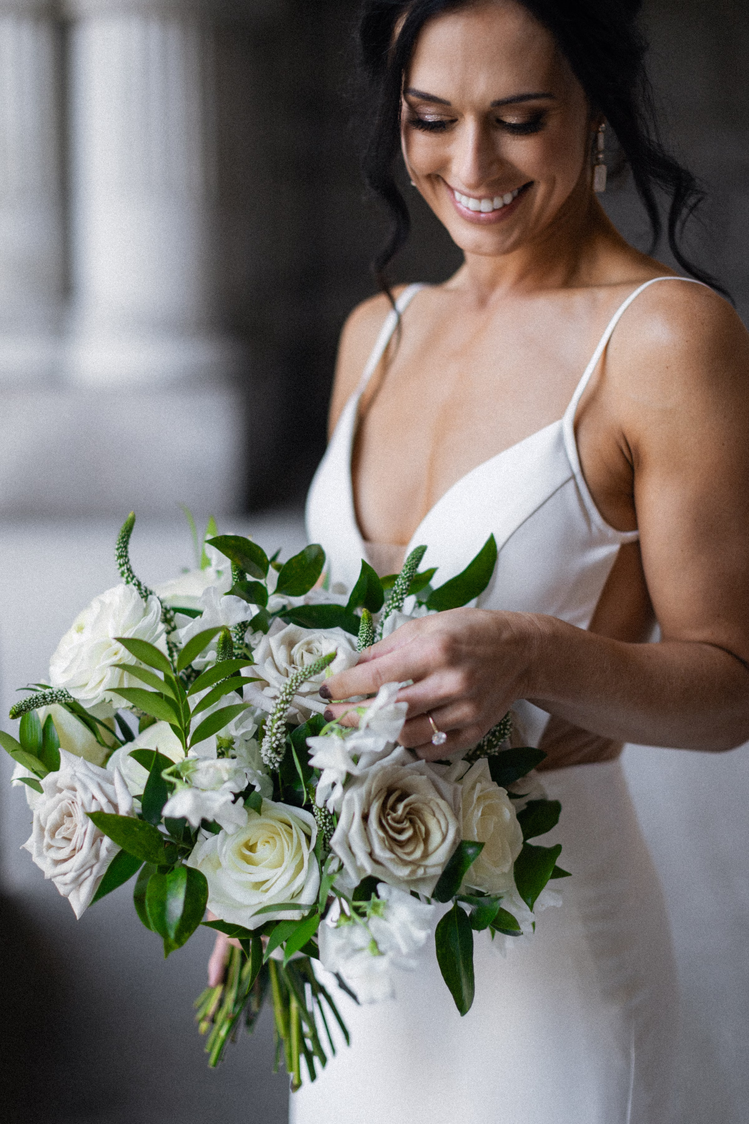 the bride holds a bouquet from Jane Kelly Floral