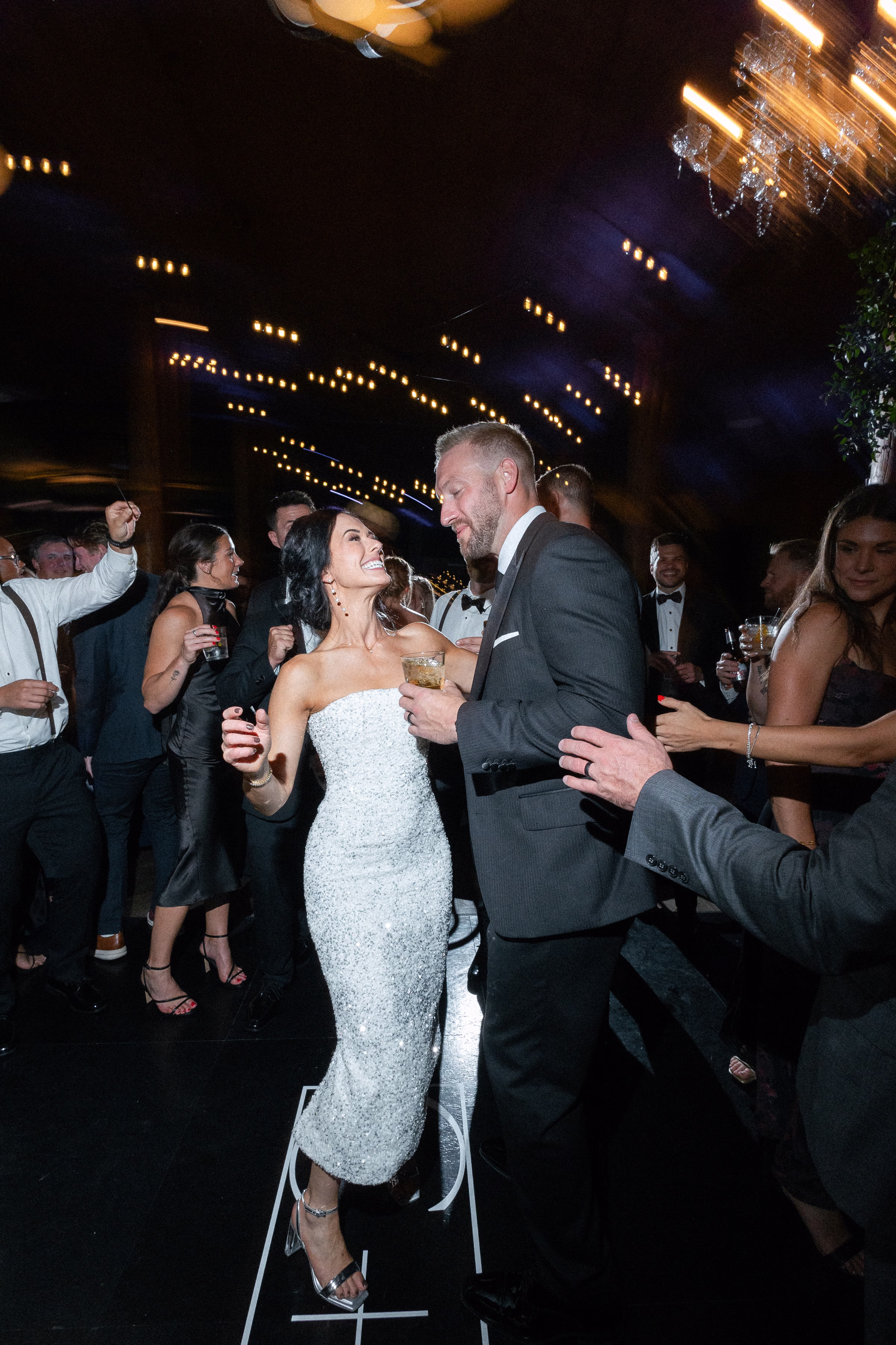 the bride debuts a strapless, glittering dress for the reception