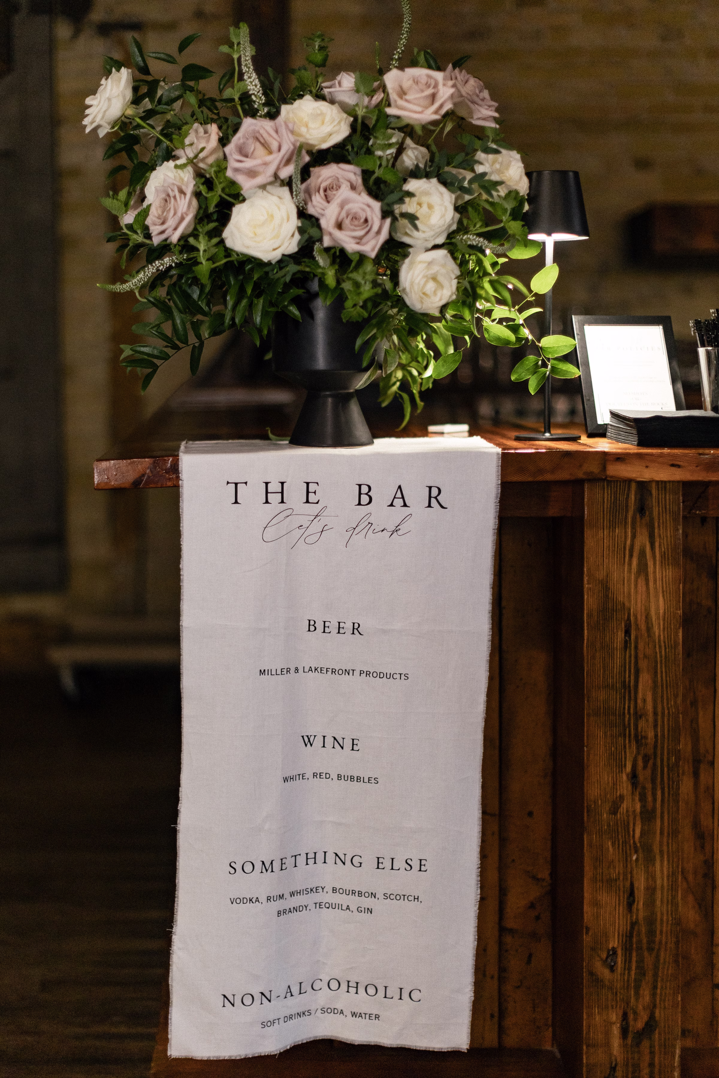 a linen bar sign draped from the edge of the bar