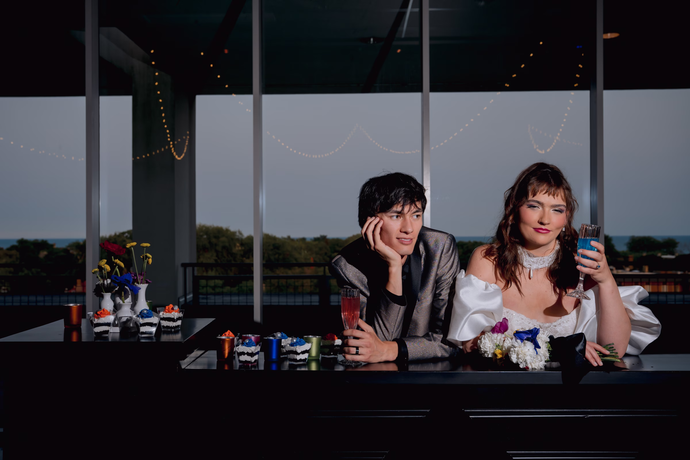 bride and groom models pose at a bar from Bartique Bars with custom drinks and desserts