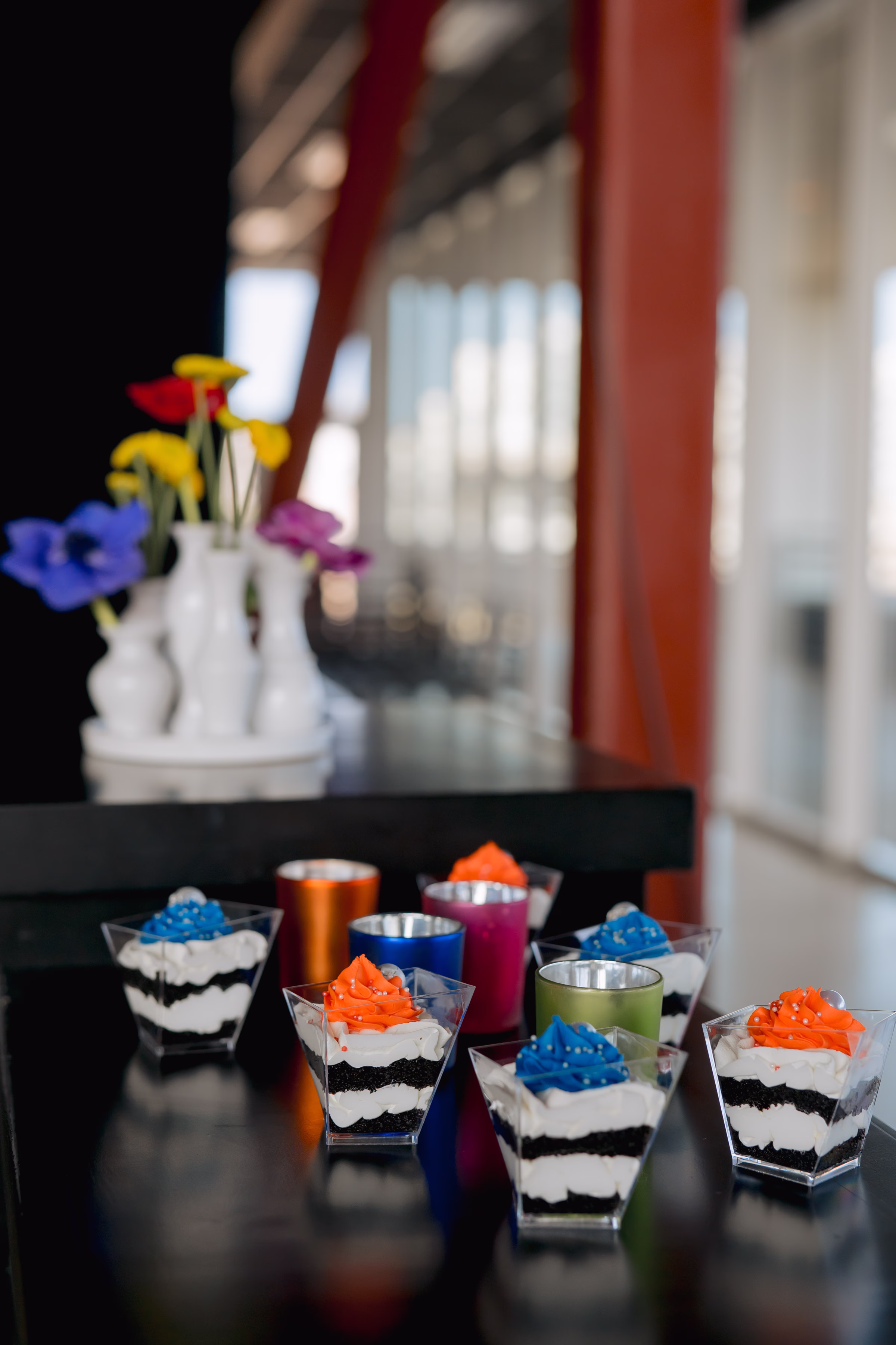 cake-cups™ from Cowboy David's Bakery topped with either cobalt or orange frosting