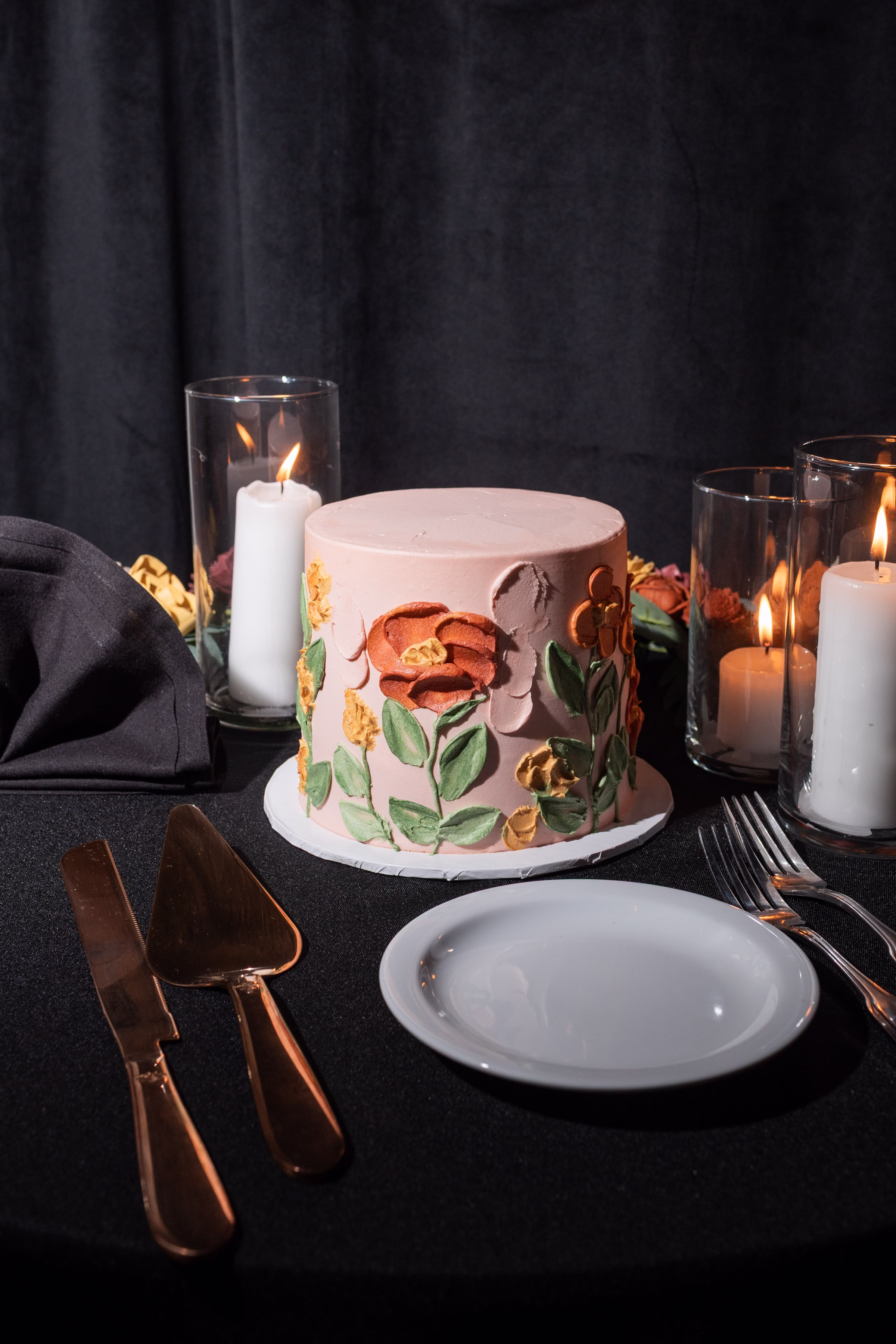 moody romantic fall wedding loft on broadway milwaukee reception cake 690 1095 - A Moody, Romantic Fall Wedding at The Loft on Broadway | Sarah + Nathan a single-tier, blush wedding cake from Whisk Chick, with colorful painted frosting florals and botanicals in green, yellow, and orange