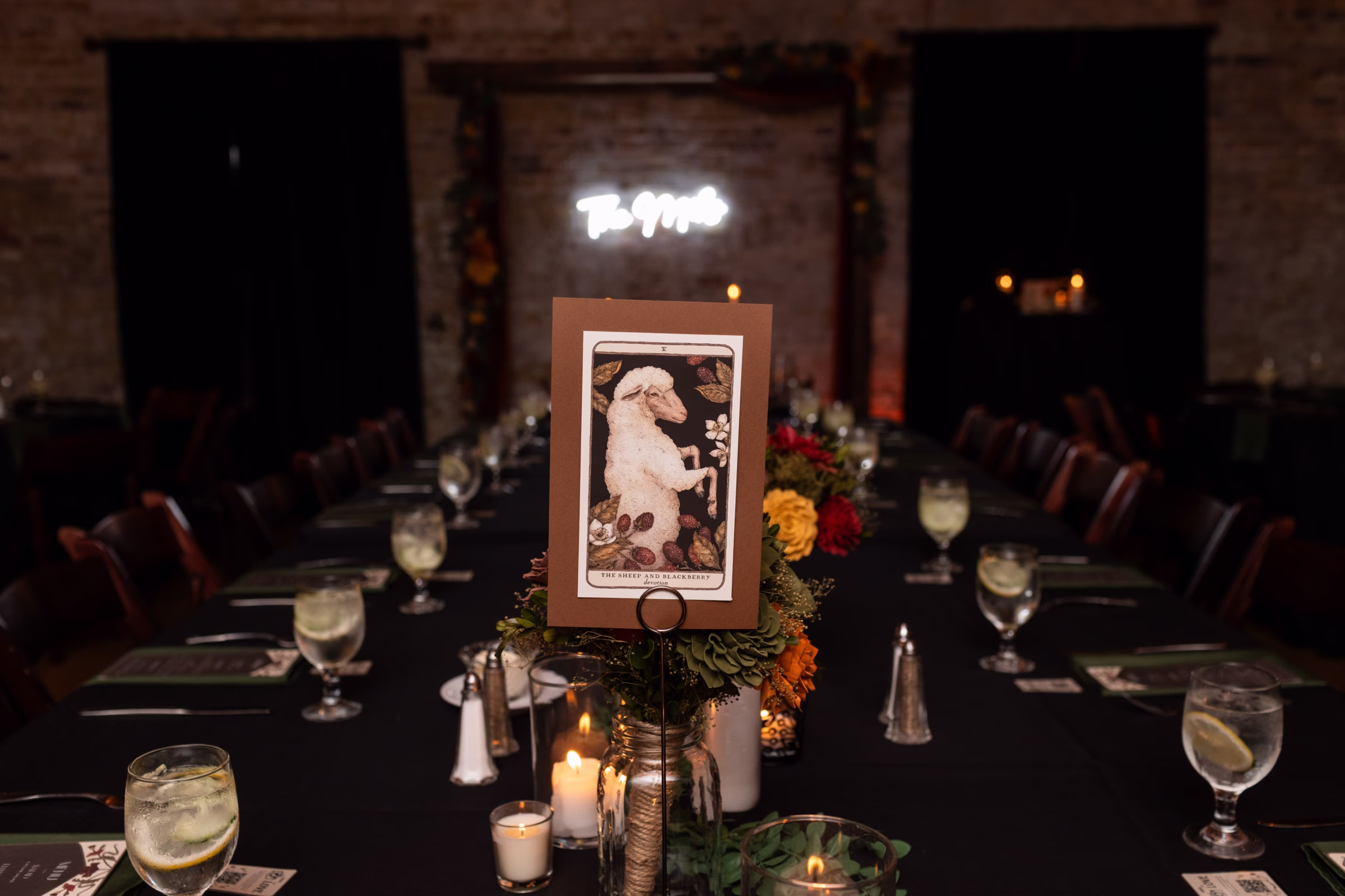 moody romantic fall wedding loft on broadway milwaukee reception centerpieces table numbers tarot 666 1060 - A Moody, Romantic Fall Wedding at The Loft on Broadway | Sarah + Nathan oracle card table number at a moody fall wedding tablescape in Milwaukee, Wisconsin