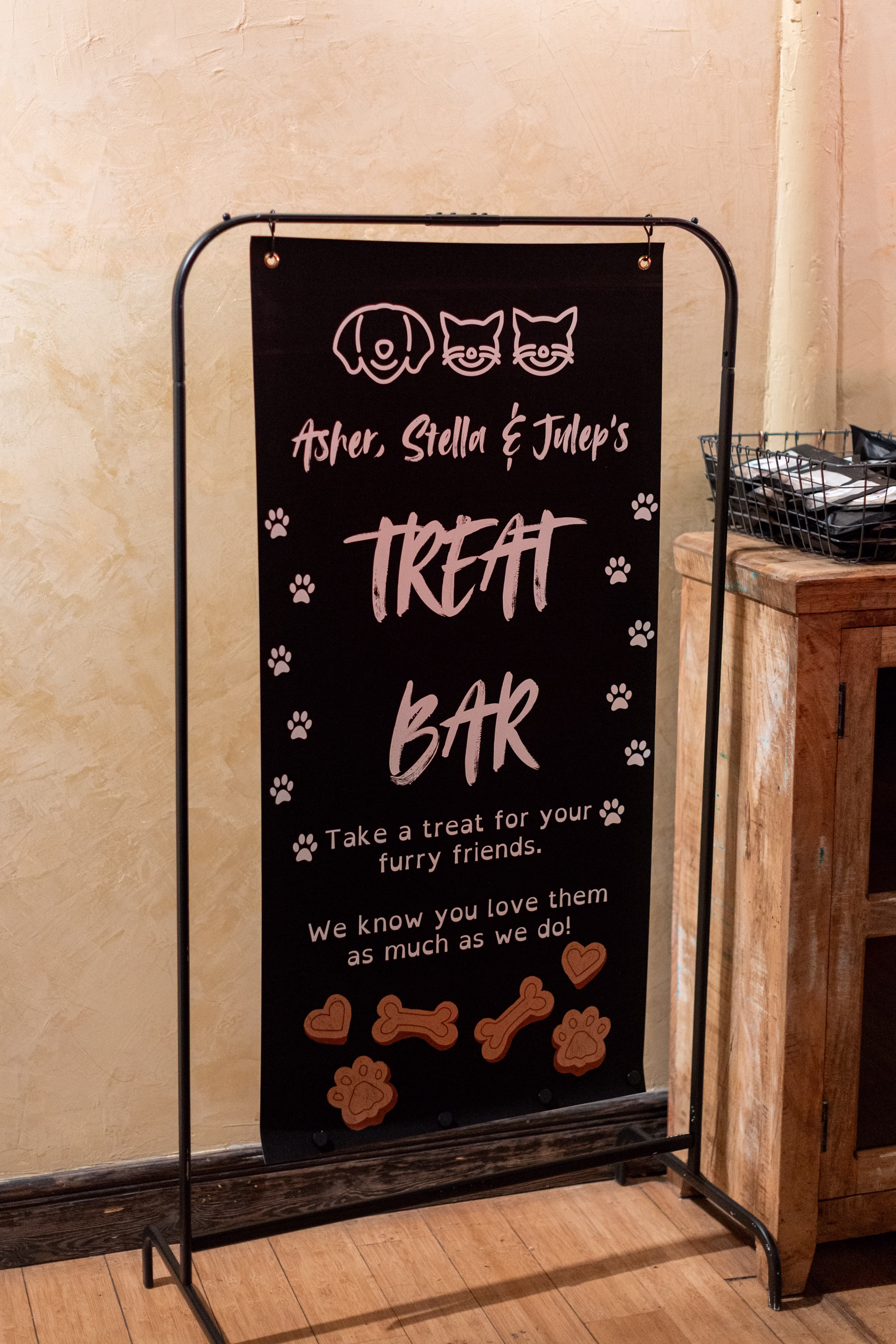 moody romantic fall wedding loft on broadway milwaukee reception signage 385 10770 - A Moody, Romantic Fall Wedding at The Loft on Broadway | Sarah + Nathan wedding signage leading guests to take customized favors for their pets. The couple incorporated illustrations of their dog and two cats, and the sign says "Asher, Stella, & Julep's Treat Bar. Take a treat for your furry friends. We know you love them as much as we do!"