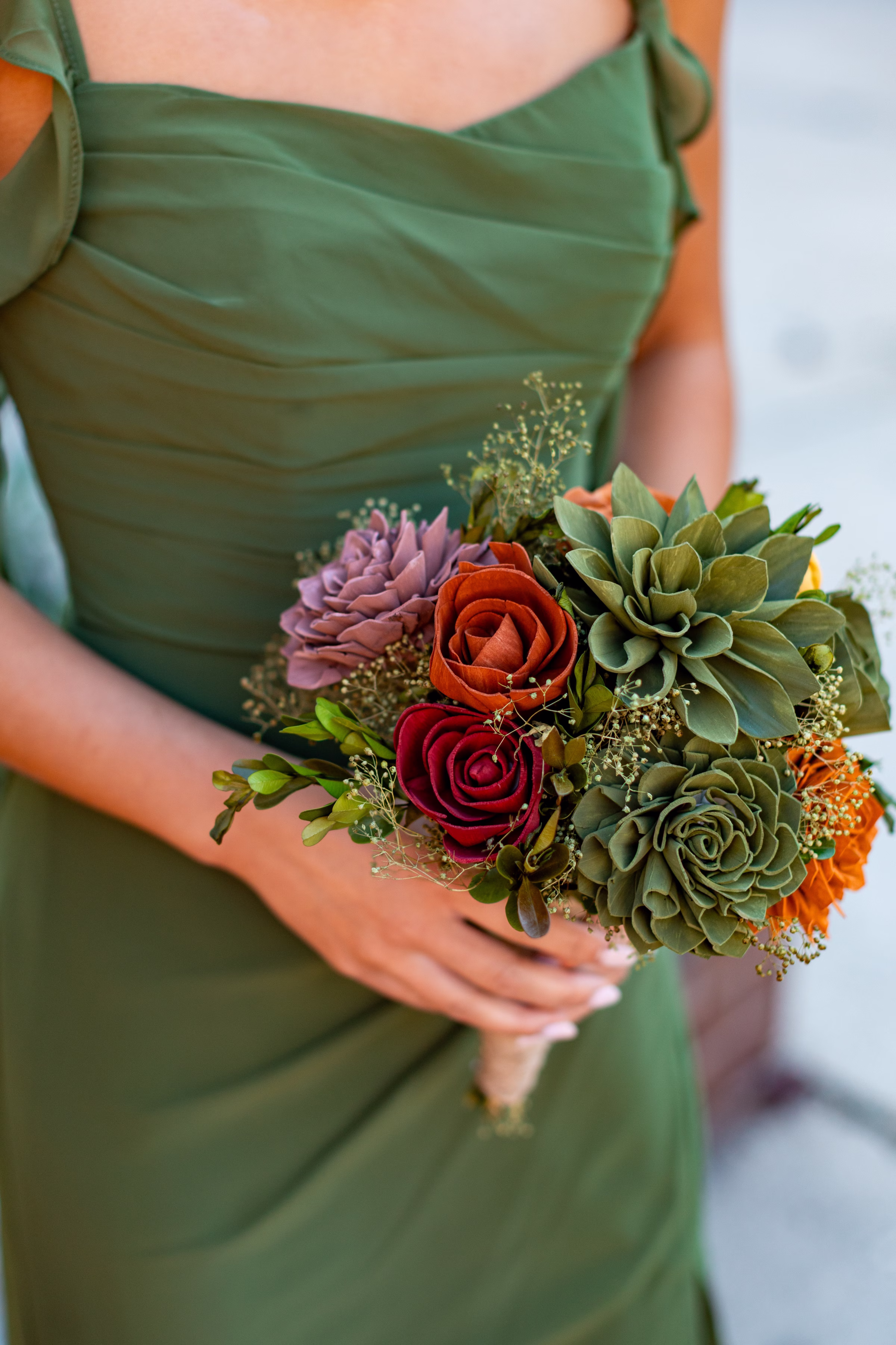 moody romantic fall wedding loft on broadway milwaukee wisconsin bridesmaids portraits 230 10449 - A Moody, Romantic Fall Wedding at The Loft on Broadway | Sarah + Nathan a close-up on a bridesmaid bouquet from Sola Wood Flowers in green, orange, red, and lavender