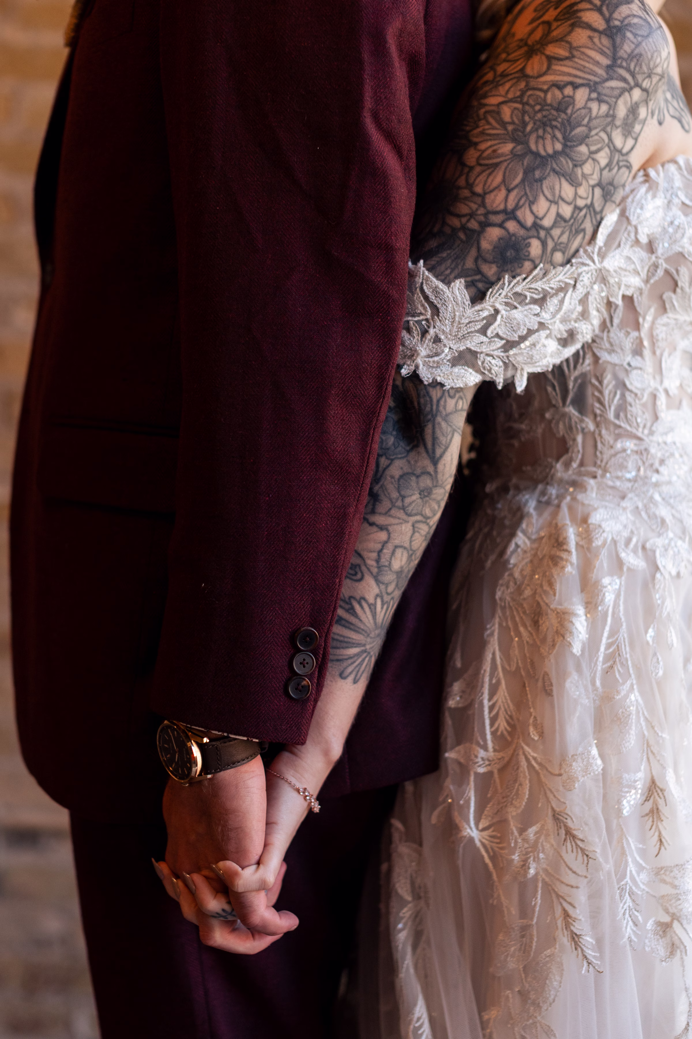 moody romantic fall wedding loft on broadway milwaukee wisconsin getting ready 301 10627 - A Moody, Romantic Fall Wedding at The Loft on Broadway | Sarah + Nathan a close-up photo of a bride and groom standing back-to-back, holding hands during a private vow exchange at The Loft on Broadway