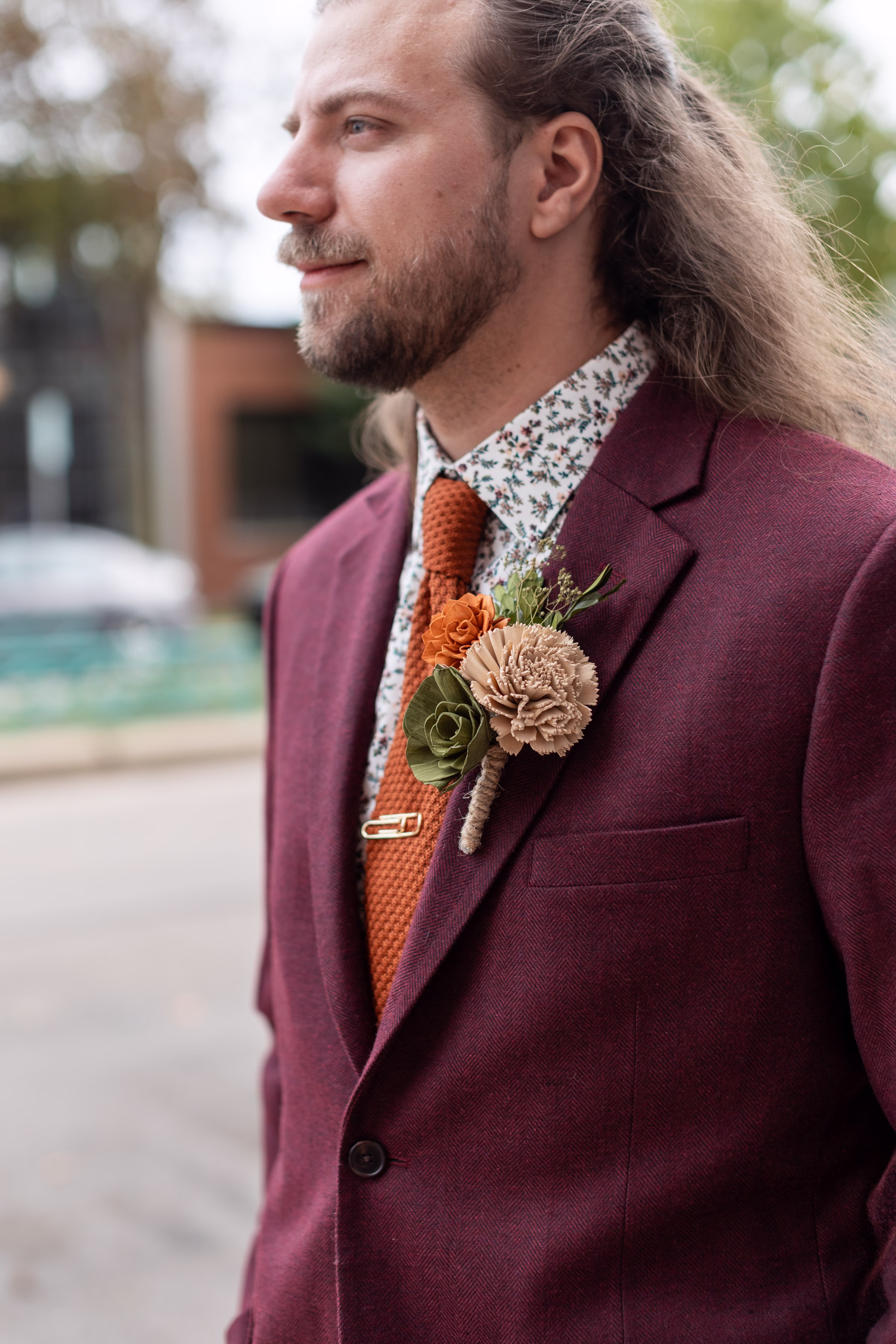 moody romantic fall wedding loft on broadway milwaukee wisconsin groomsmen 107 10310 - A Moody, Romantic Fall Wedding at The Loft on Broadway | Sarah + Nathan a close-up on a wooden flower boutonnière from Sola Wood Flowers