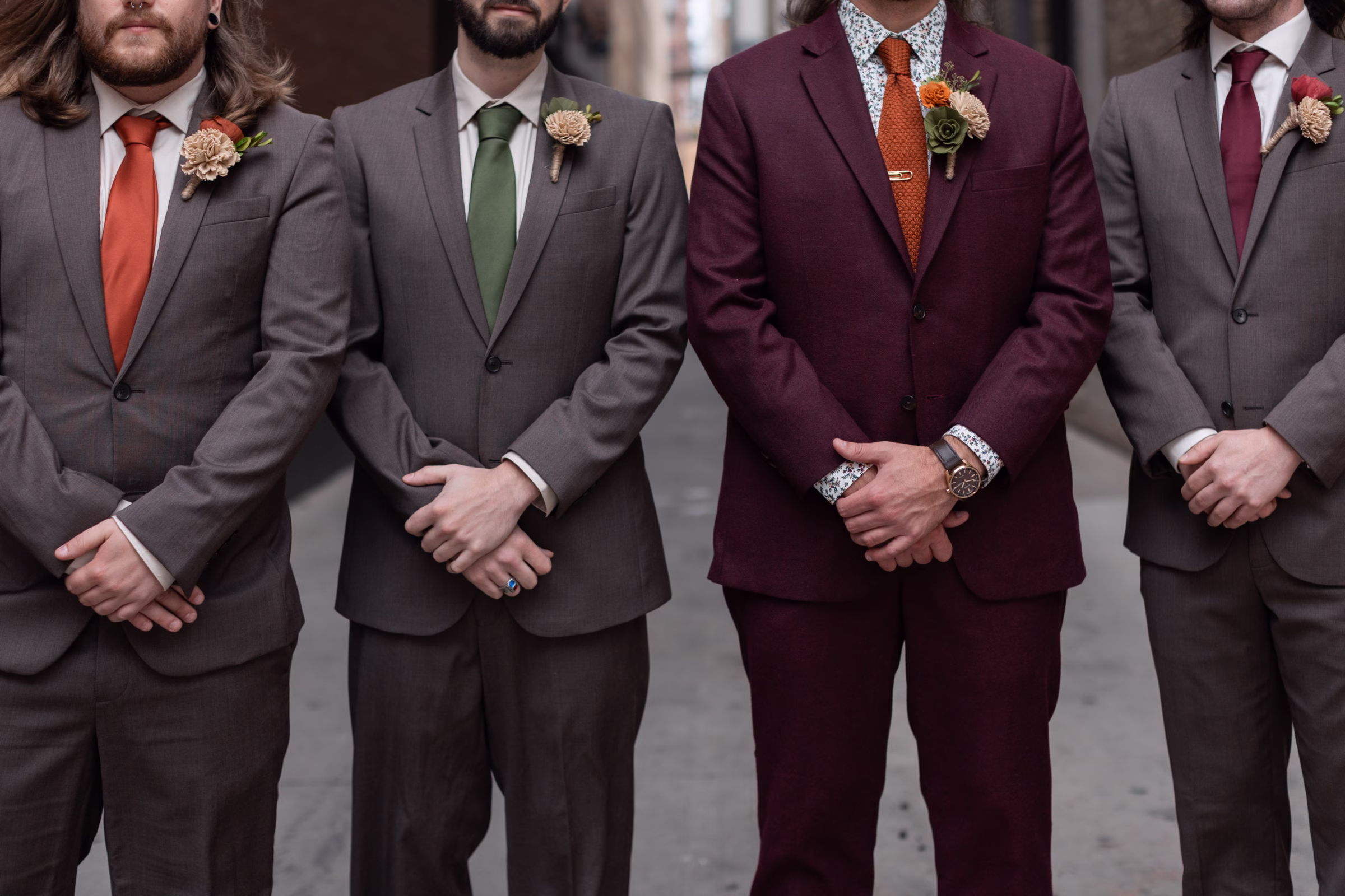 moody romantic fall wedding loft on broadway milwaukee wisconsin groomsmen 50 10092 - A Moody, Romantic Fall Wedding at The Loft on Broadway | Sarah + Nathan a groom stands beside his groomsmen for a photo focused on menswear fashions from Studio Suits