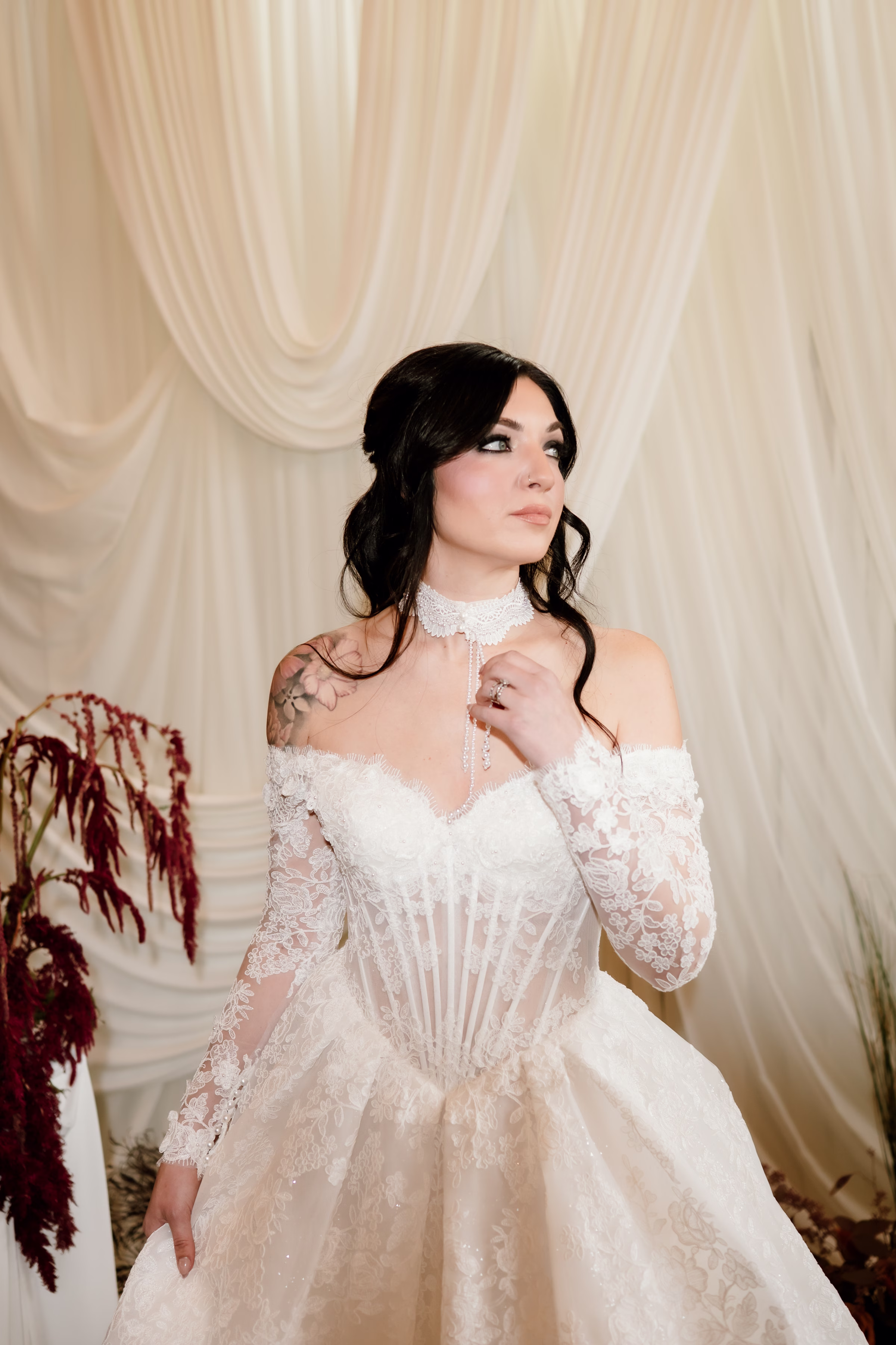 rich velvet fall wedding inspiration mercantile hall burlington wisconsin ceremony draping bride fashion 128 - Rich Velvet Fall Wedding Inspiration at Mercantile Hall in Burlington, Wisconsin a bride wearing a lace dress from Bon Bon Belle Bridal boutique. Her hair is wavy and secured into a half-updo by Kinsey Swartout Hairstylist, and her makeup by NK Artistry LLC pairs dramatic eyes with soft pinks on the cheeks and lips
